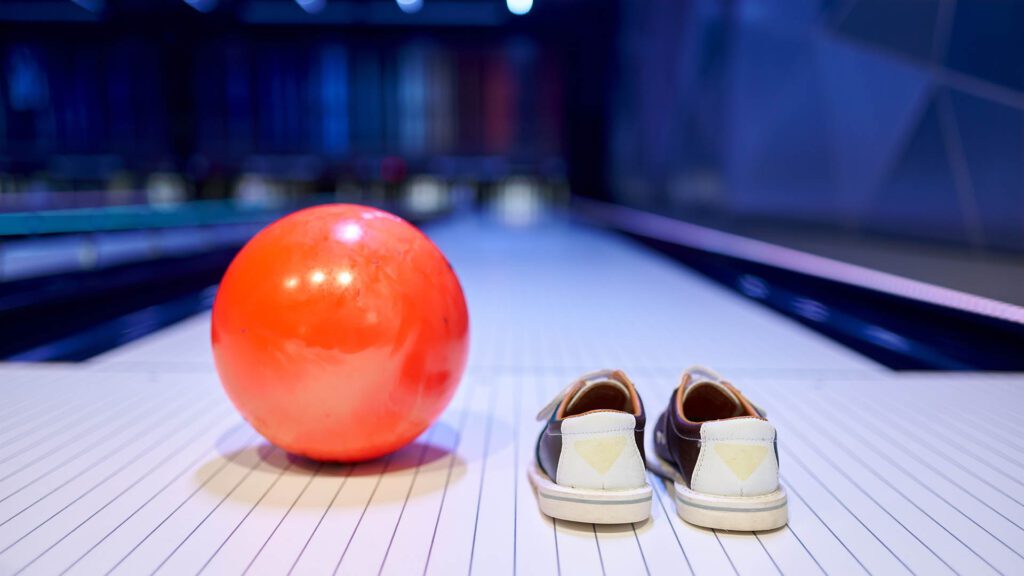 Ball and shoes on bowling lane