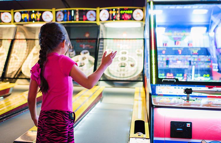 Young Woman Playing arcade games