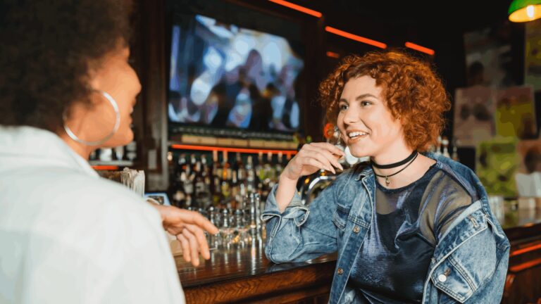 Women discussing at bar