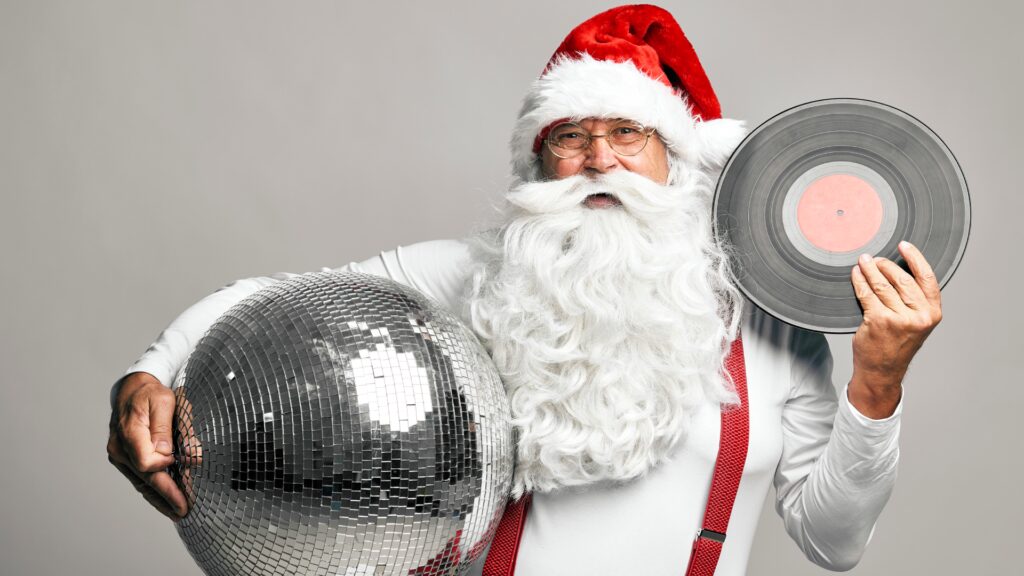 Santa holding a record and disco ball